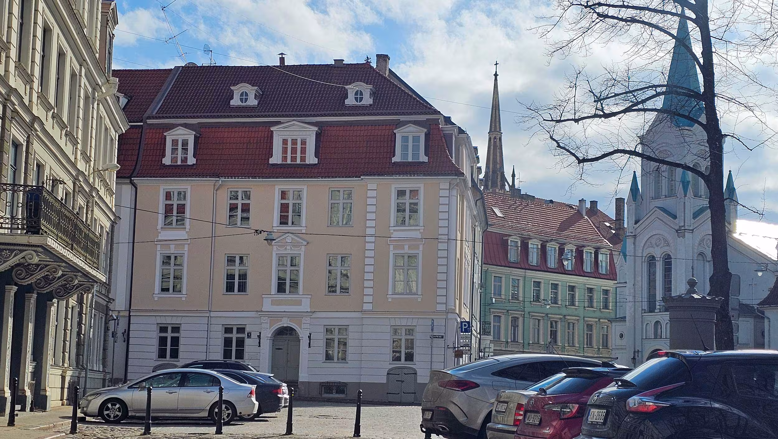 Contextual view of the 1 Pils Street renovation project situated in the heart of Riga's historic centre, illustrating the building's integration into the surrounding streetscape.