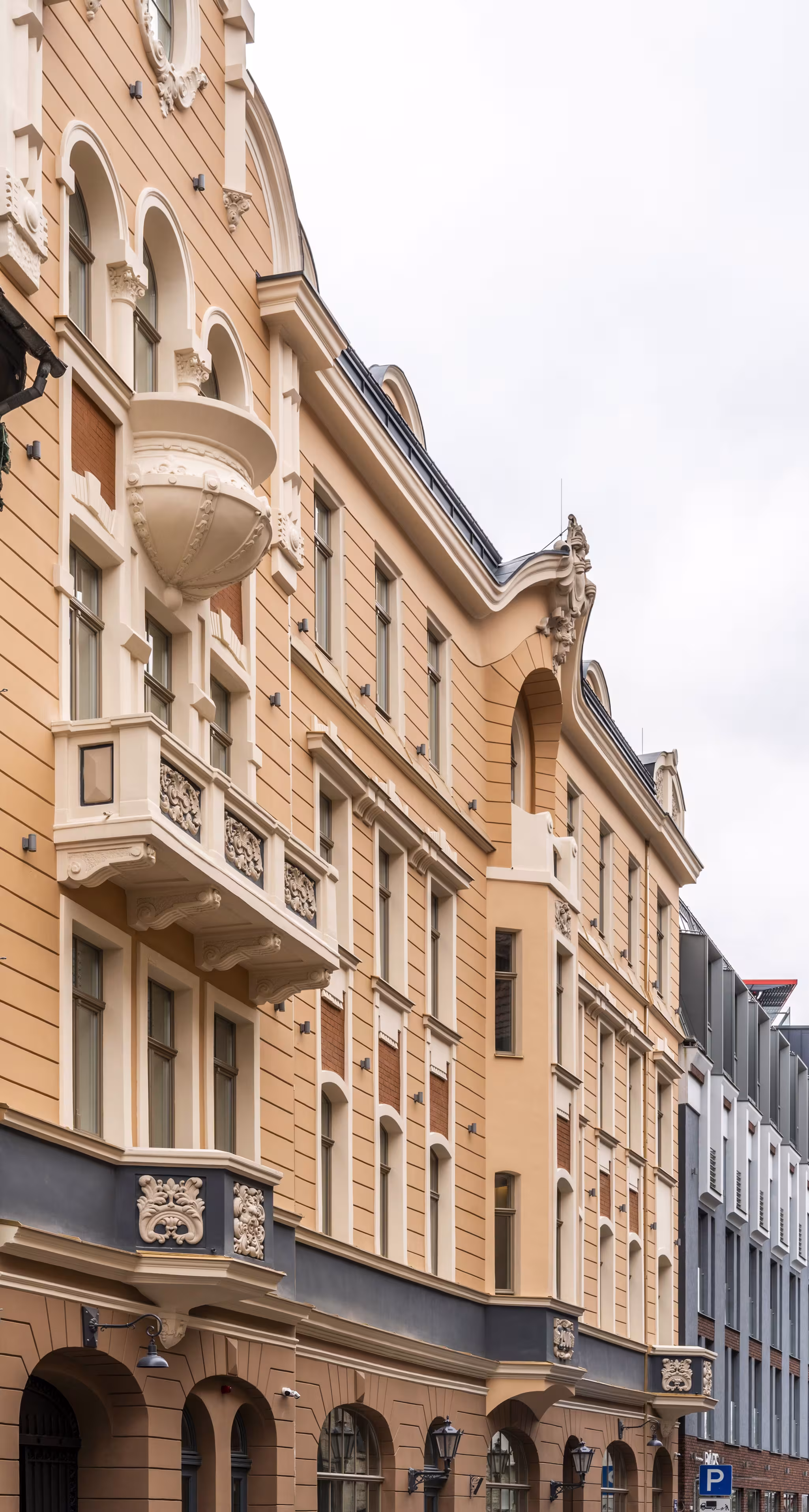 The Riverside SPA Hotel features an elegant, multi-story facade with beige walls and ornate details.