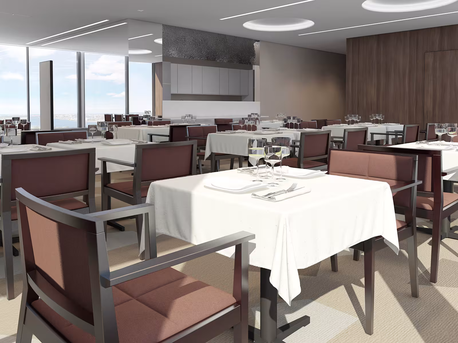 Dining setup at Sky Point with panoramic windows, showing elegant tables and chairs arranged for a formal event with city views.