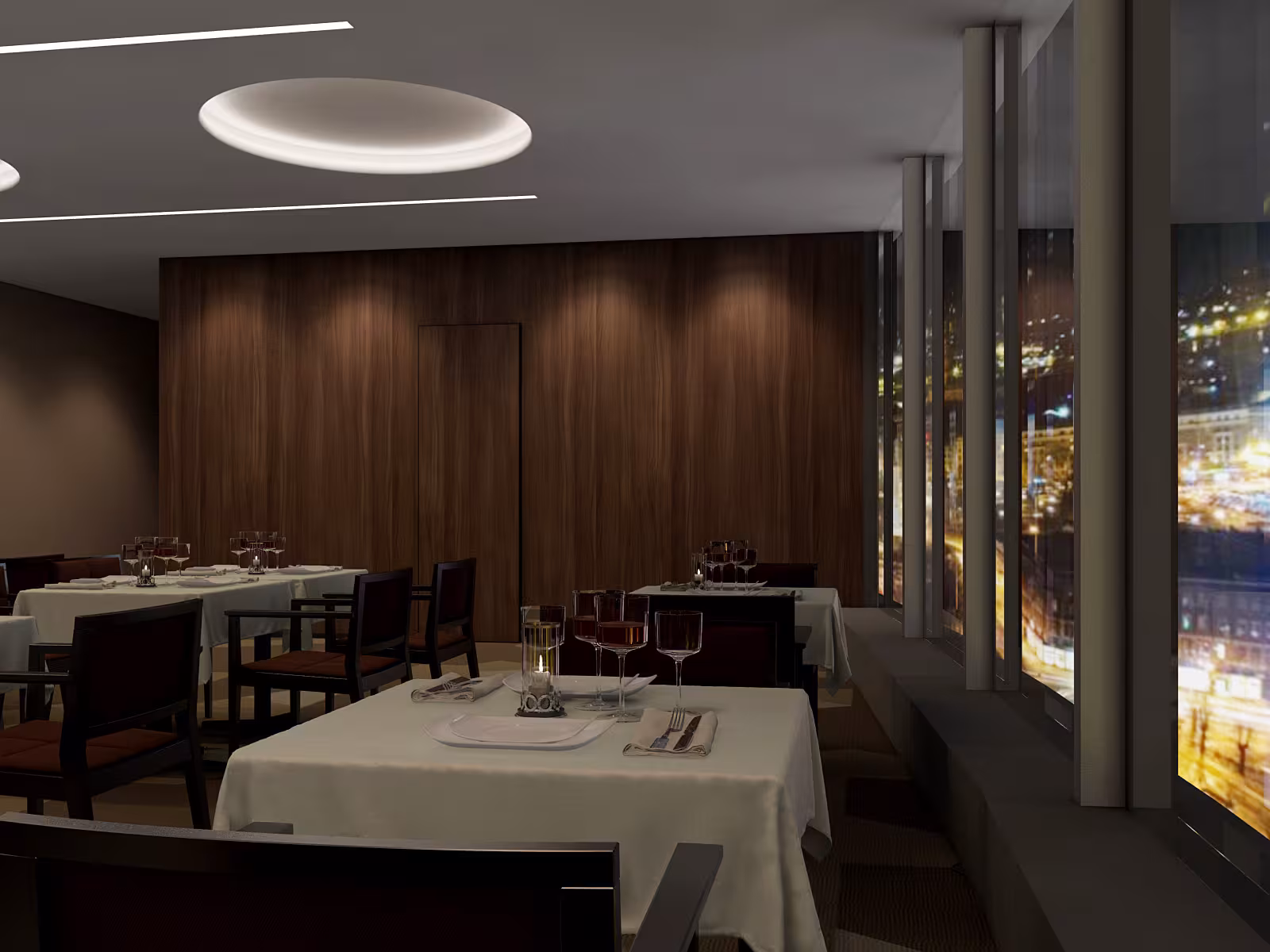 Evening atmosphere at Sky Point venue with dimmed lighting, creating an intimate setting against the backdrop of Riga's night lights.
